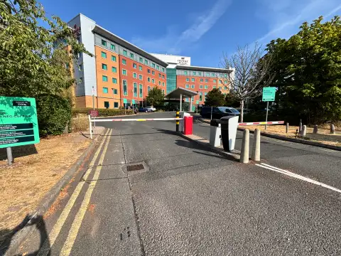 Entrance to the Crowne Plaza is barrier control and cameras.
