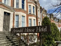 The Arundel House Hotel exterior signage from the pavement.