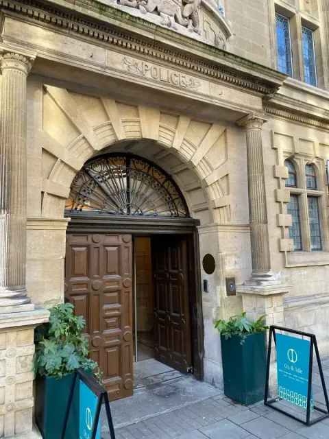 Main door of the Hobson with the old “Police” sign from the Victorian era above the door. 