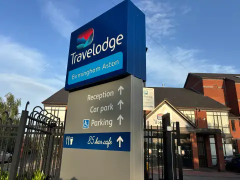 Travelodge Birmingham Aston hotel exterior entrance and clearly visible signs.