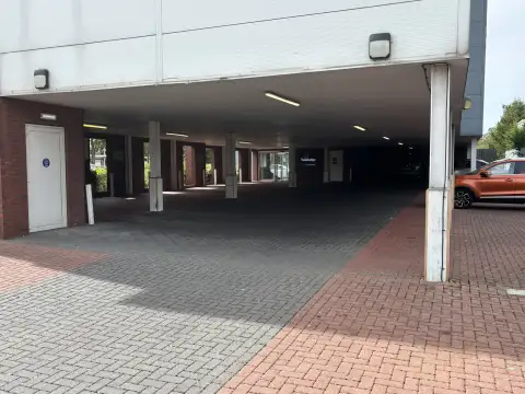 Travelodge Birmingham Perry Barr has parking "underneath" the hotel as well as at the front.
