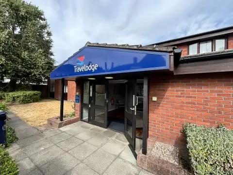 Travelodge Birmingham Sutton Coldfield hotel exterior and entrance to reception.