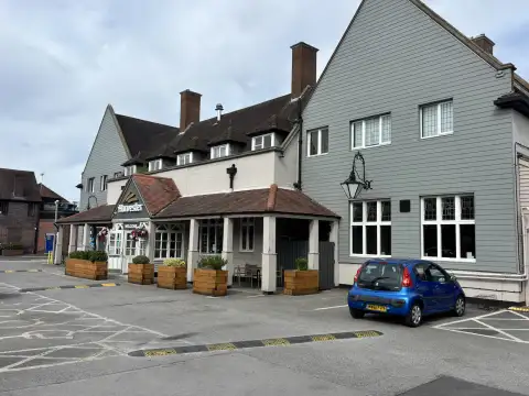 The hotel sits behind The Harvester. they share the same site and car park.
